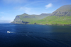 Sørvágsfjørður fjord, Vágar island, Faroes: a fishing boat leaves for the ocean - bow waves - photo by A.Ferrari