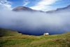 Sørvágsfjørður fjord, Vágar island, Faroes: fog and cottage on the cliff edge - photo by A.Ferrari