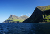 Vágar island, Faroes: coastal cliffs and Árnafjall mountain - below it the village of Gásadalur - photo by A.Ferrari