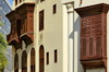 Jeddah, Mecca Region, Saudi Arabia: Al Balad historic district - arabian closed balconies, mashrabiyas - Hejazi architecture of Bait Al Balad and a modern facade - Unesco world heritage site - photo by M.Torres